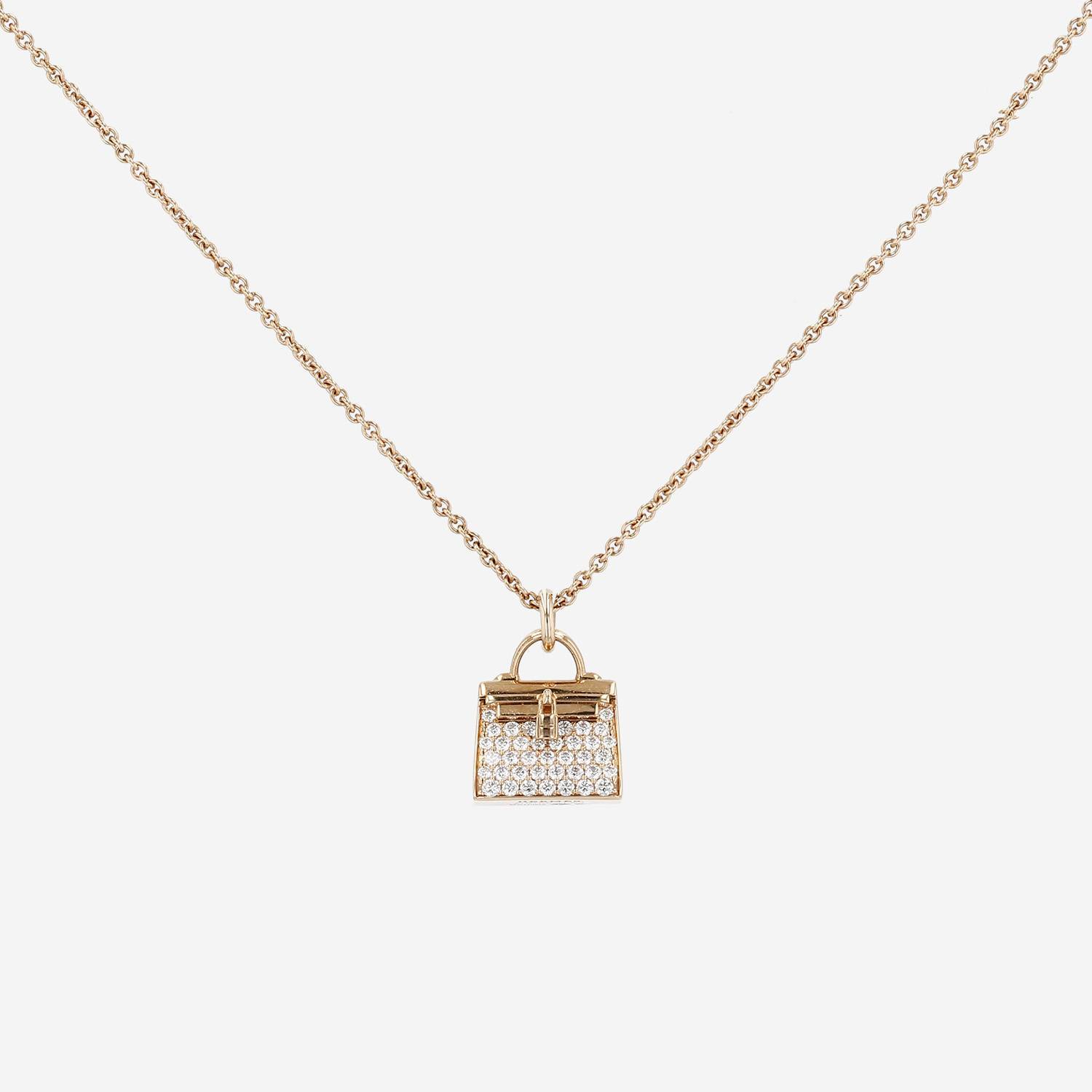 Pendentif Hermès Amulettes Kelly en or rose et diamants Pendentif Hermès Amulettes Kelly en or rose et diamants
