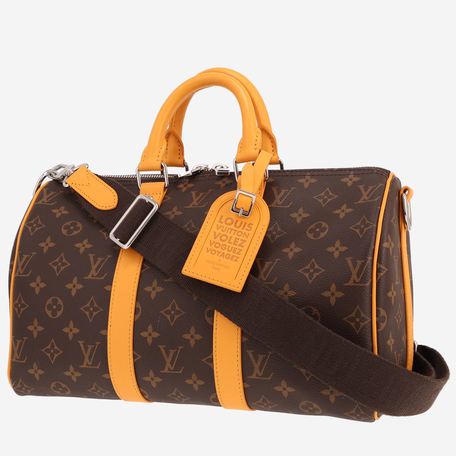 Sac bandoulière Louis Vuitton Keepall XS en toile monogram marron et cuir jaune Sac bandoulière Louis Vuitton Keepall XS en toile monogram marron et cuir jaune